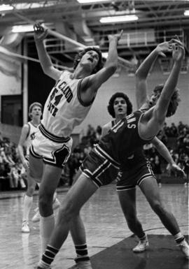 Dan Hagen jumps for a basketball, St. Cloud State University