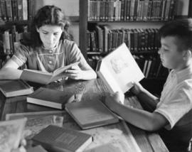 Children read books at Riverview (1913), St. Cloud State University