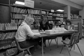 Kathy Farrell helps students in the Curriculum Materials Laboratory, College of Education, St. Cloud State University