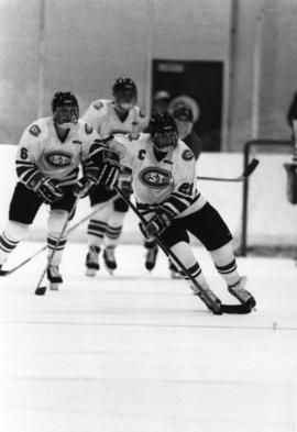 A hockey player with a puck, St. Cloud State University