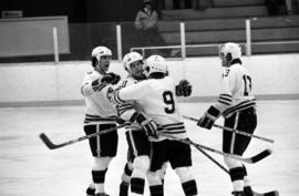 St. Cloud State hockey player Jeff Passolt celebrates a goal with teammates during a game