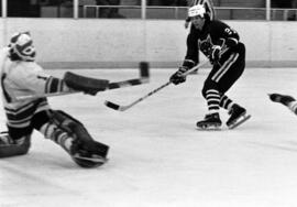 St. Cloud State hockey player Pat Sullivan shoots the puck against St. John's University in men's hockey