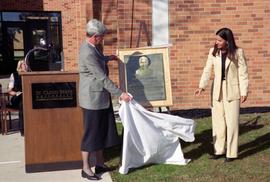 President Suzanne Williams unveils the a plaque during the renaming of the Business College to G.R. Herberger College of Business, St. Cloud State University