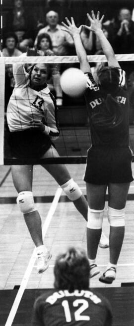 Volleyball player Becky Stream spikes a volleyball during a match, St. Cloud State University