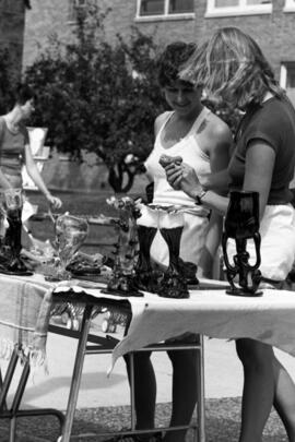 People inspect merchandise, Lemonade Concert and Art Fair, St. Cloud State University