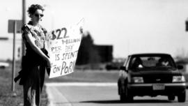 Sarah Cimperman protests at the adult book store Library 18, St. Cloud State University