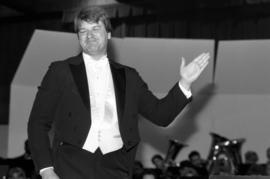 Rich Hansen conducts the band at a homecoming concert, St. Cloud State University