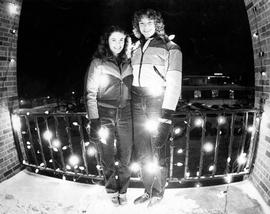 Lynne Smelter and Lori Boots display their balcony decorations at Benton Hall (1967), St. Cloud State University