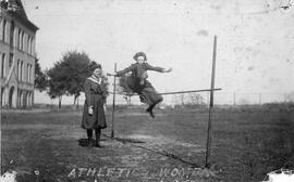 A female student jumps over a high bar, St. Cloud State University