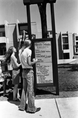 A sign showing order of songs for orchestra performance, Lemonade Concert and Art Fair, St. Cloud State University