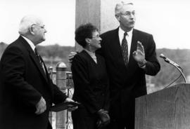 President Bruce Grube congratulates Steve and Jeannie Lindgren at the dedication of the Lindgren Child Care Center, St. Cloud State University