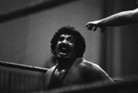 Wrestler Sheik Adnan El Kaissey gives his opponent a mean look during a match at Halenbeck Hall (1965), St. Cloud State University