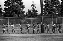 Spectators line the outfield fence during a St. Cloud State University baseball game against Northern State University