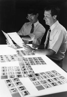 Steve Koyama looks at contact sheets, St. Cloud State University