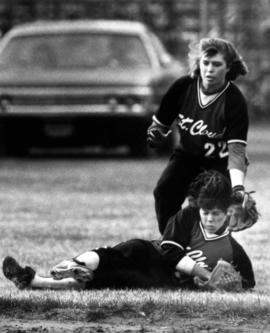 Two St. Cloud State softball players try to field a softball during a game