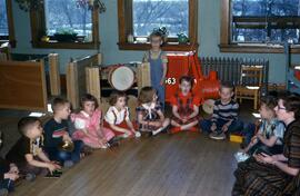 Children play musical instruments and sing at Riverview (1913), St. Cloud State University