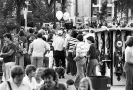 People walk past art vendors, Lemonade Concert and Art Fair, St. Cloud State University