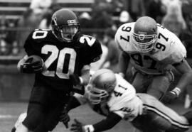 Randy Martin runs with a football during a game, St. Cloud State University