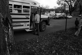 A man gets on a bus for the abortion protest in St. Cloud