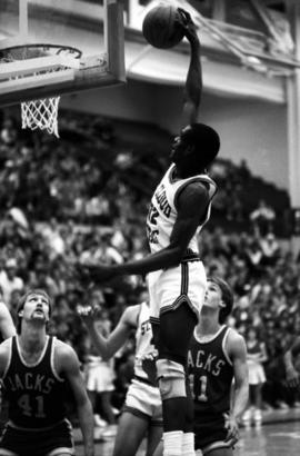 Basketball player Kevin Catron dunks a basketball in a game against South Dakota State University, St. Cloud State University