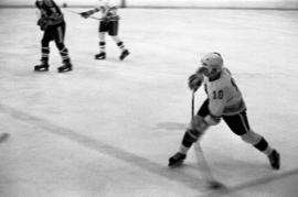 St. Cloud State hockey player Jeff Passolt shoots the puck during a game