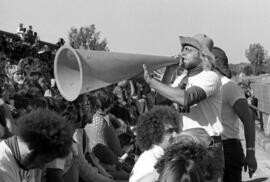 Man with megaphone at a St. Cloud State University football game against Moorhead State University