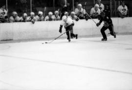 St. Cloud State hockey player Bob Motzko moves the puck during a men's hockey game against the University of Wisconsin-River Falls