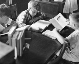 Children read books at Riverview (1913), St. Cloud State University