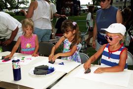 Children sit together at a table creating art, Lemonade Concert and Art Fair, St. Cloud State University