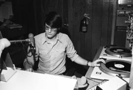 A man broadcasts at KVSC studios, St. Cloud State University