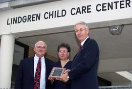 Bruce Grube hands Steve and Jeannie Lindgren a plaque at the Lindgren Child Care Center dedication, St. Cloud State University