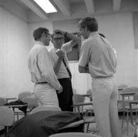 John Denver, Mike Kobluk, and David Boise of the Mitchell Trio are interviewed by WJON's Mike Diem before their concert at Halenbeck Hall (1966), St. Cloud State University