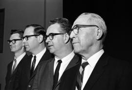 Four men stand together, St. Cloud State University