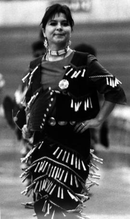 Woman in costume at a pow wow, St. Cloud State University