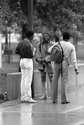 Three students talk, St. Cloud State University