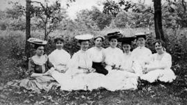 Women students sit together on the lawn, St. Cloud State University