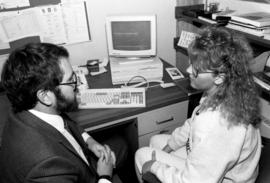 Andy Ditlevson helps student Holly Peterson at the Career Center, St. Cloud State University