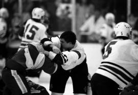 Hockey player Tony Schmalzbauer fights another player during a game against the University of Wisconsin-River Falls, St. Cloud State University