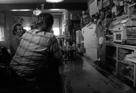 Flat Iron Bar bartender Darrell Peterson talks to customers, St. Cloud