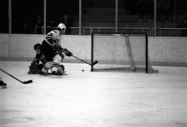 St. Cloud State University hockey player John Matchinsky tries to score a goal in a game against St. Olaf