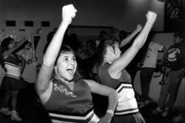 Cheerleaders lead the crowd in cheers, St. Cloud State University