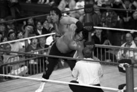 Wrestler Bret Hart puts the Honky Tonk Man in an abdominal stretch during a wrestling match at Halenbeck Hall (1965), St. Cloud State University