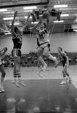 Dan Hagen drives for the basket during a basketball game against Bemidji State University, St. Cloud State University